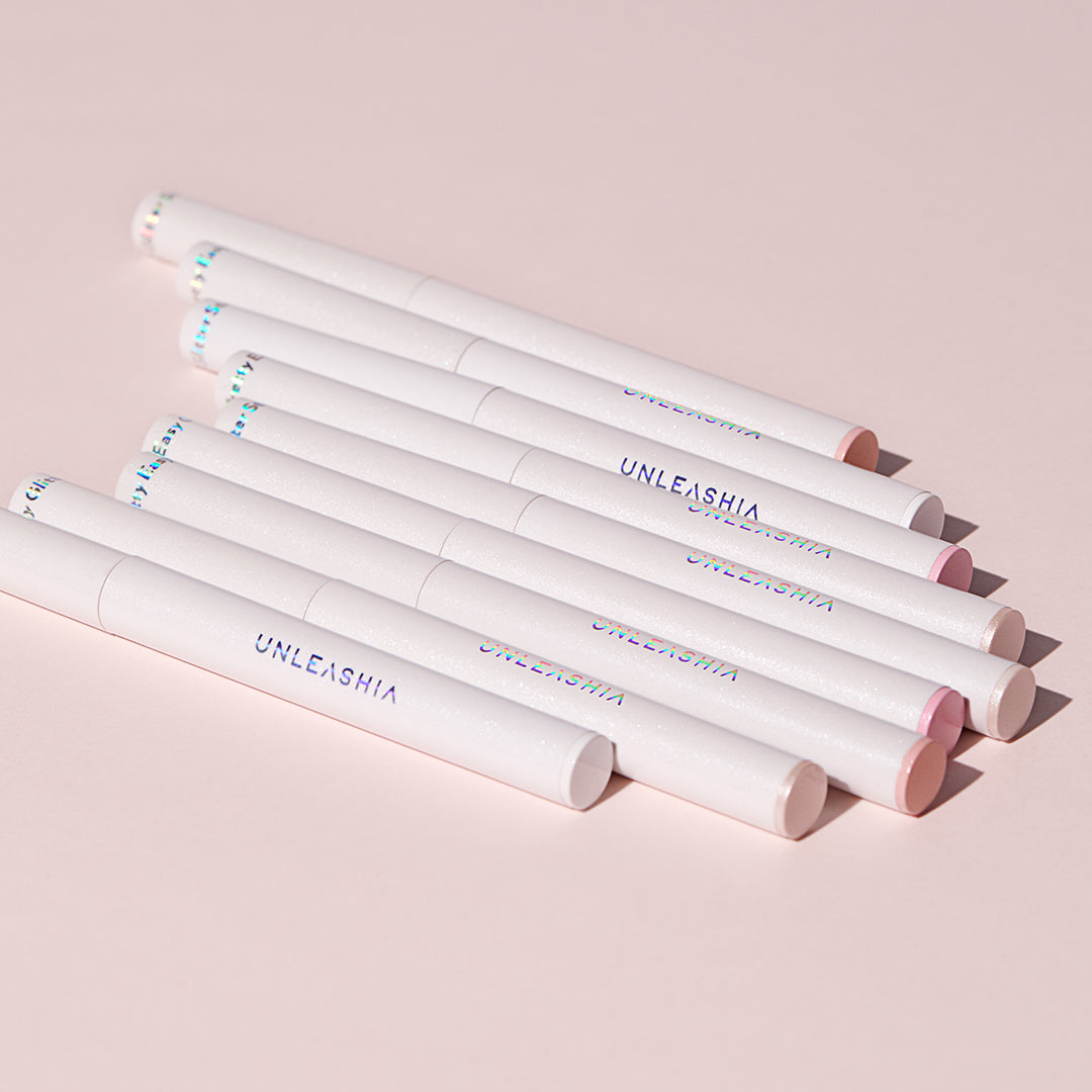 Unleashia Pretty Easy Glitter Stick eyeshadow in 7 vibrant colors, showcasing shimmering glitter and smooth application.