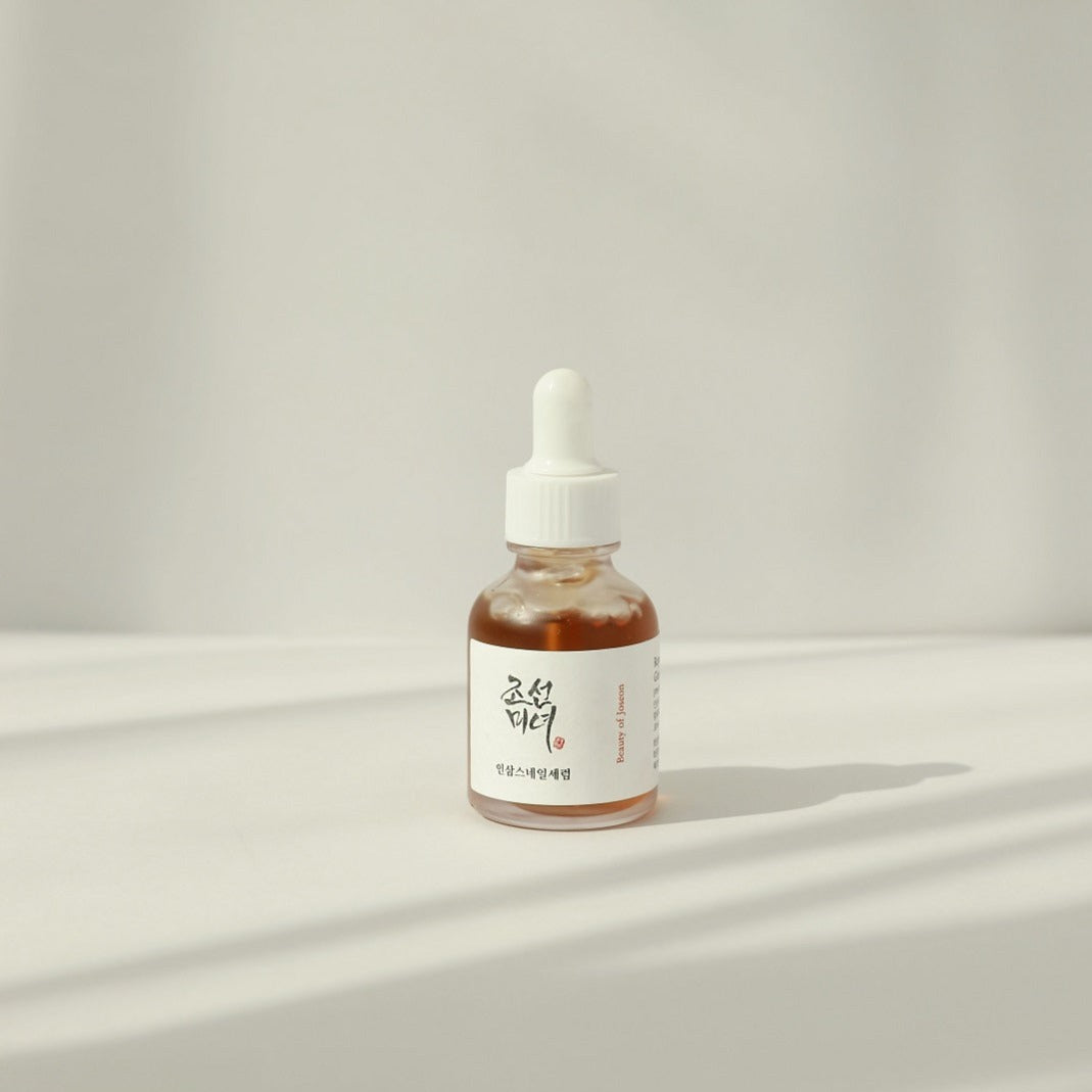 Beauty of Joseon Revive Serum with ginseng and snail mucin, 30ml, featuring a clear glass bottle and dropper applicator.