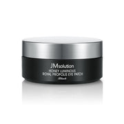 JMsolution Honey Luminous Royal Propolis Eye Patch black, 60pcs, close-up of the eye patches showing their smooth, black design.