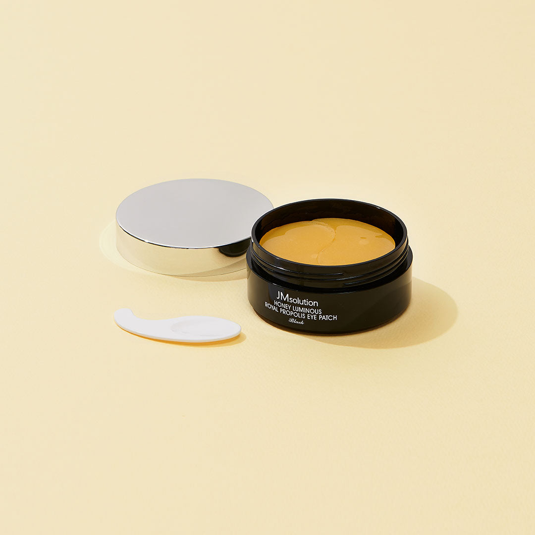 JMsolution Honey Luminous Royal Propolis Eye Patch black, 60pcs, showing the eye patches with nourishing ingredients and sleek black packaging.