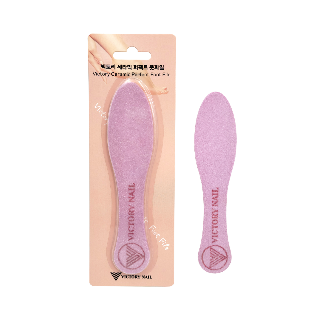Victory Nail ceramic foot file in a beauty tool set, showing a smooth, ergonomic foot file for exfoliating and smoothing feet.