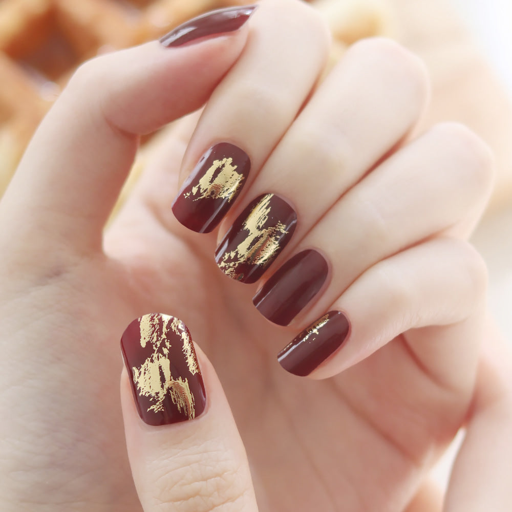Glossy Blossom Burgundy Foil Gel Nail Strips with metallic foil design on nails for a stylish, modern look.