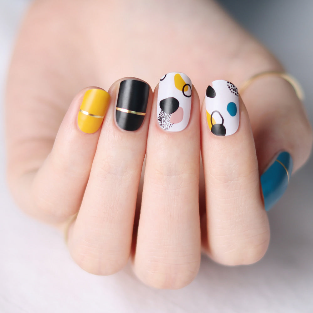 Glossy Blossom gel nail strips with hand-drawn matte design on neatly manicured nails, showcasing stylish nail art.