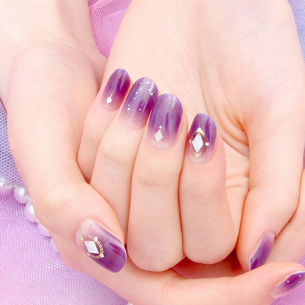 Glossy Blossom Gel Nail Strips called Serenade of Fascination with intricate floral designs on perfectly manicured nails.