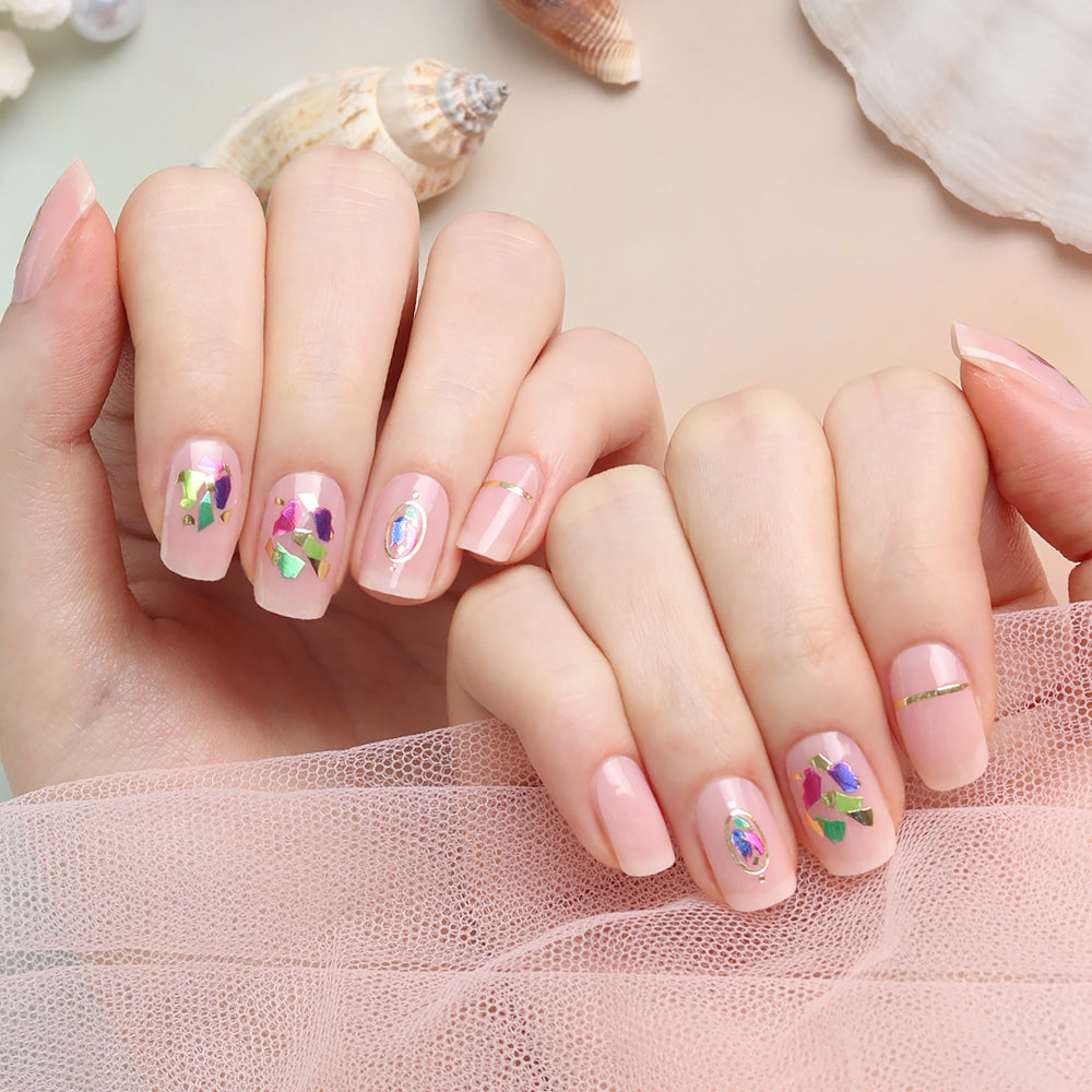 Glossy Blossom Vivid Shell gel nail strips on natural nails, showcasing bright, colorful shell-inspired design.