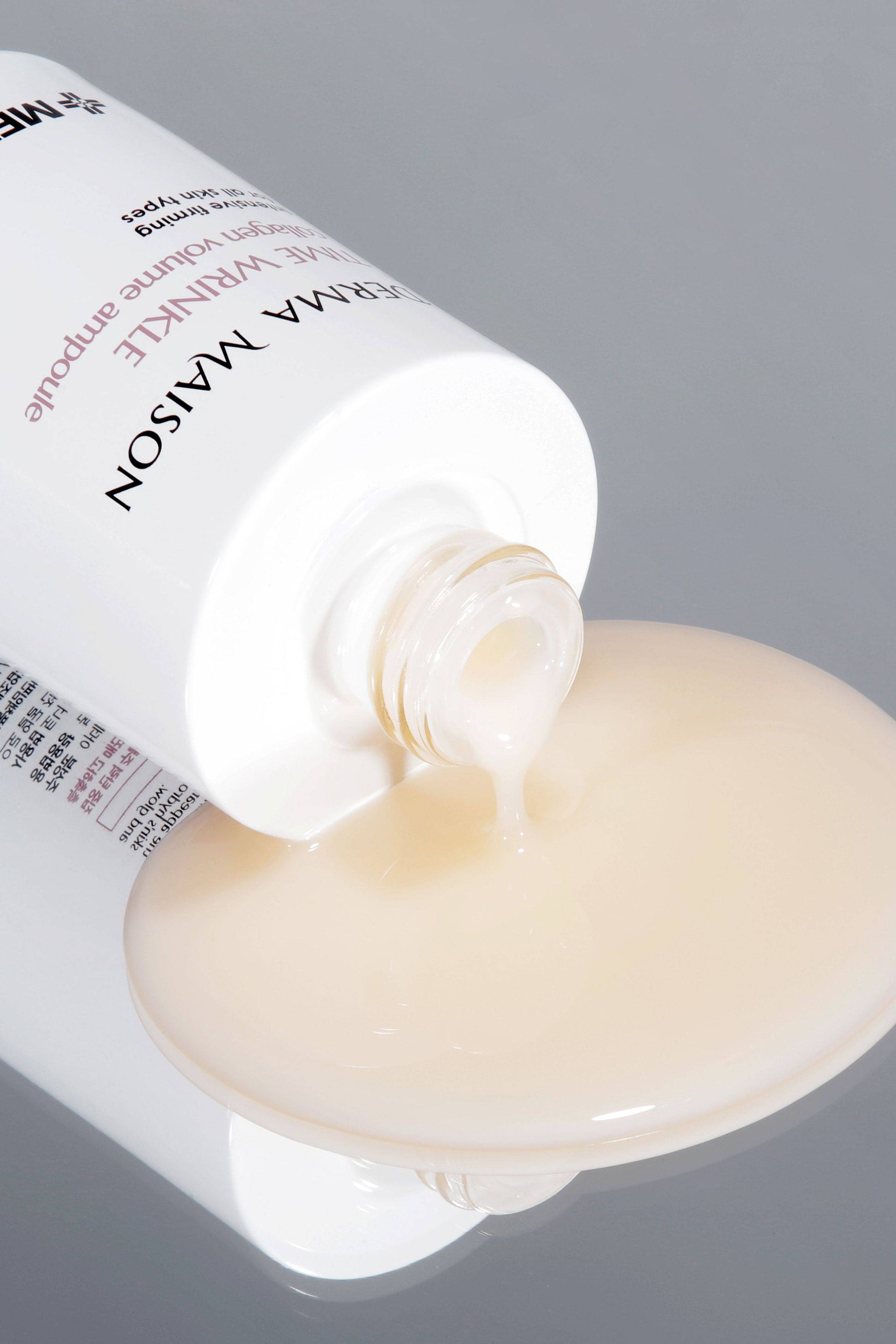 Derma Maison Time Wrinkle Collagen Volume Ampoule in a clear 100ml bottle, designed to reduce wrinkles and boost skin volume.