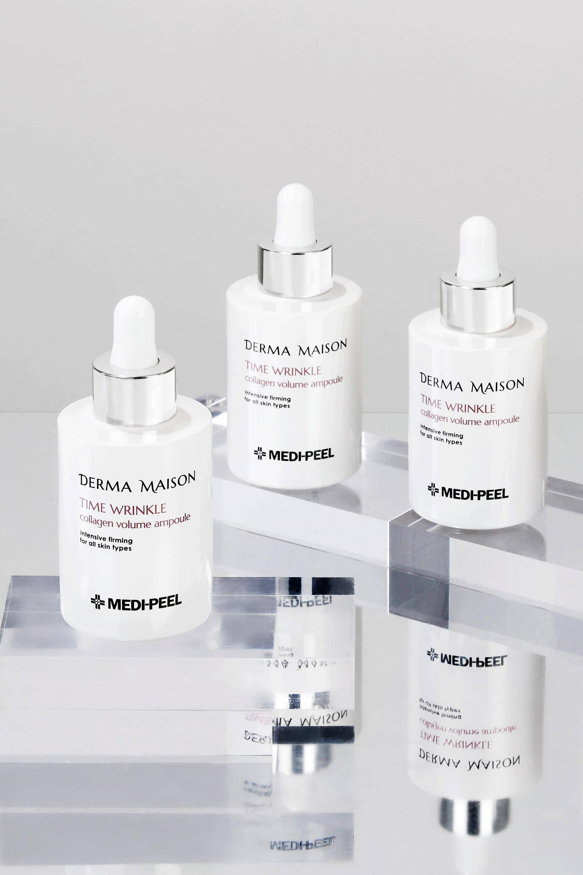 Derma Maison Time Wrinkle Collagen Volume Ampoule 100ml bottle with serum, designed to reduce wrinkles and boost skin volume.