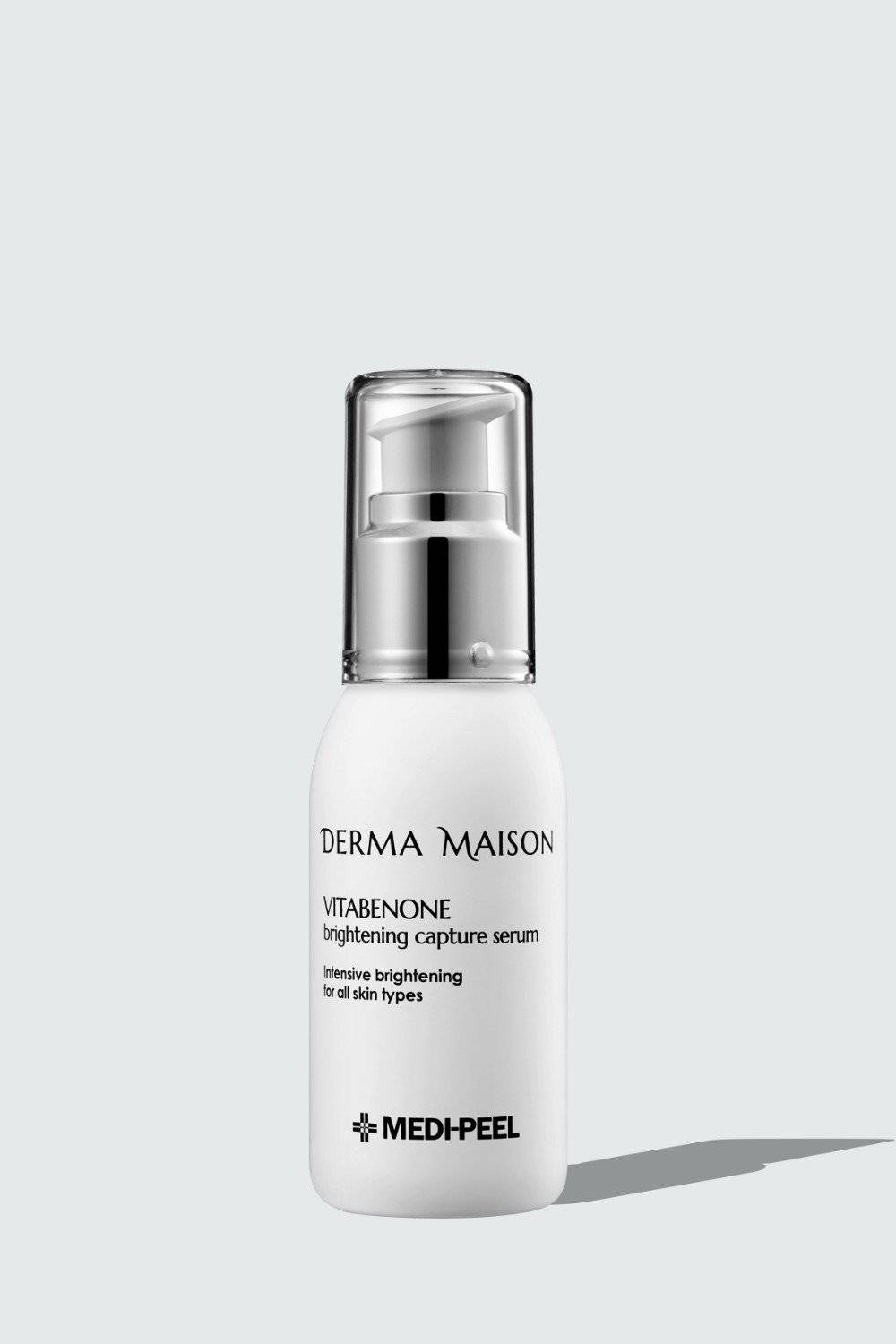 Derma Maison Vitabenone Brightening Capture Serum bottle, clear serum in a sleek container with a white cap.