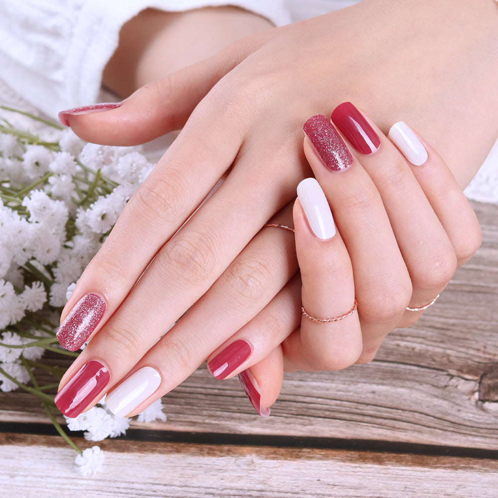 Glossy Blossom Carmine Rose gel nail strips on neatly manicured nails with a glossy finish.