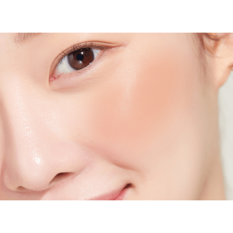 Peripera Pure Blushed Sunshine Cheek blush in shade 01, showing the soft peachy-pink color and smooth powder texture.
