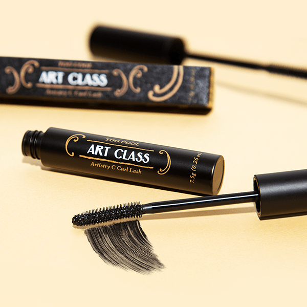 Too Cool For School Artclass Artistry C Curl Lash Mascara brush and wand with black mascara on a clean background