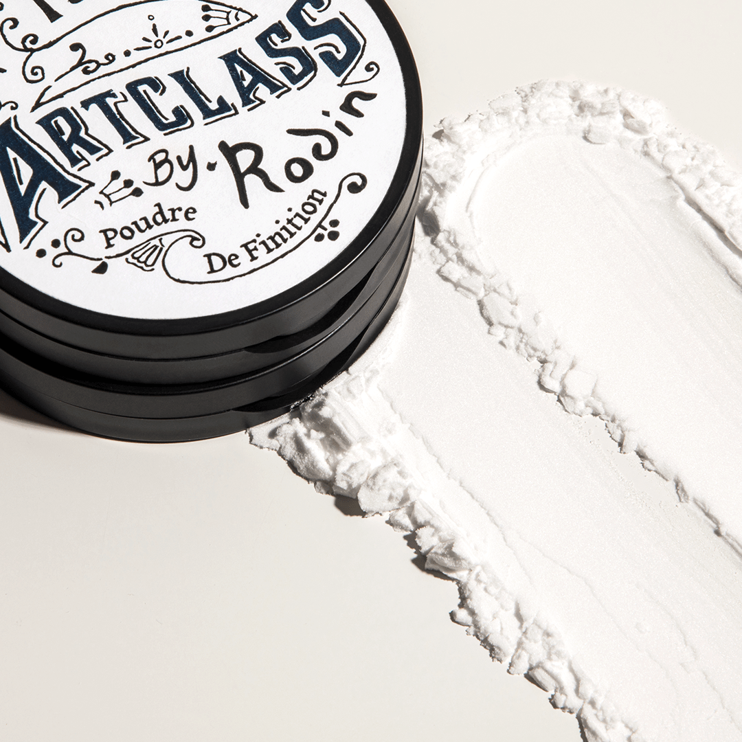 Too Cool For School Artclass By Rodin Finish Setting Pact, a translucent setting powder in a compact container.