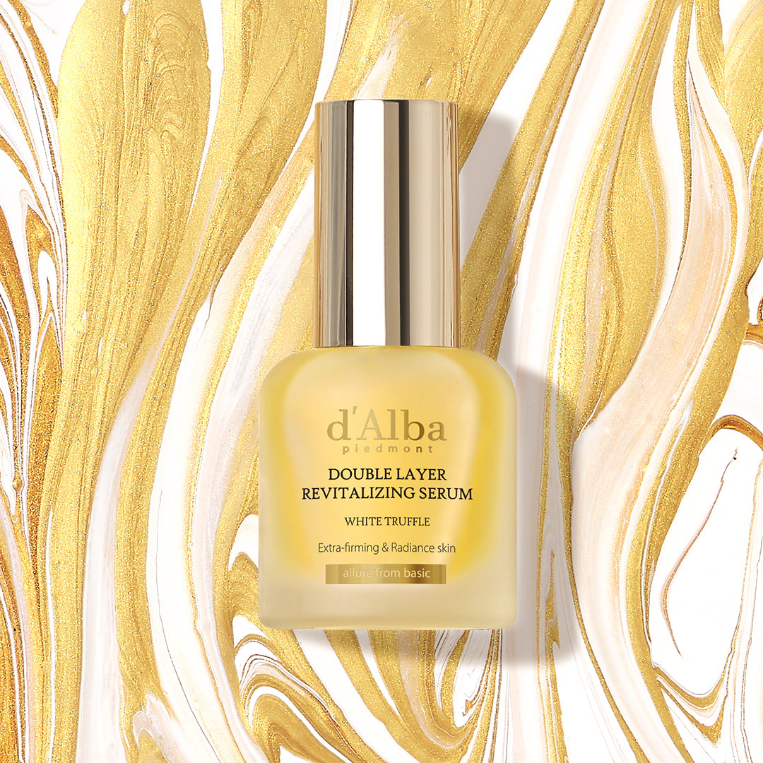 d'Alba White Truffle Double Layer Revitalising Serum in a clear glass bottle with a dropper, showcasing its luxurious packaging.